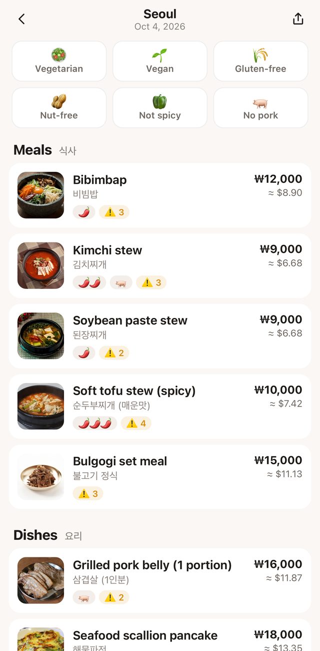 Gourmo explaining a Korean menu in Seoul dish by dish, with prices in dollars